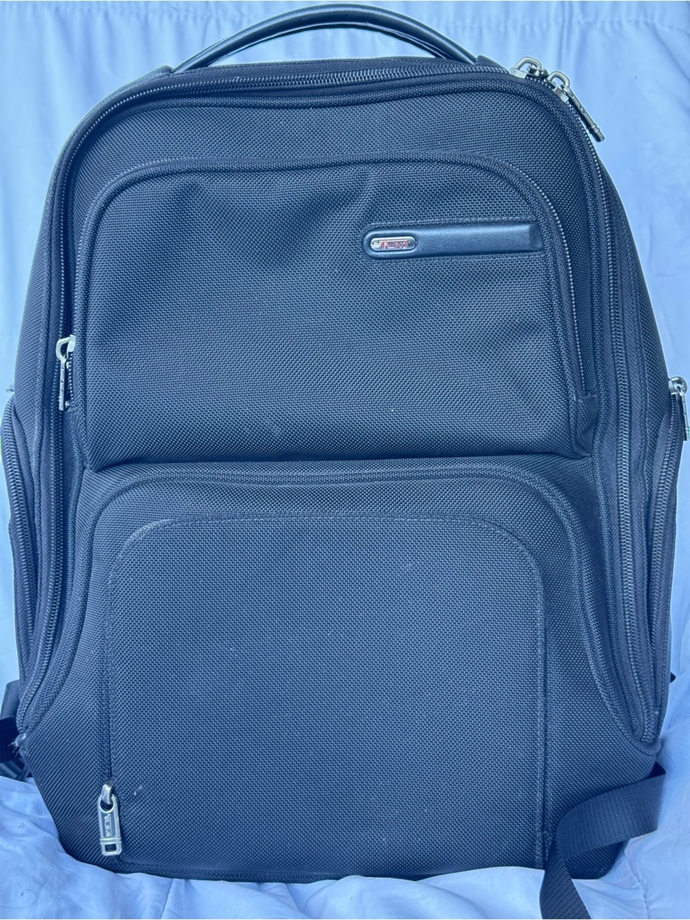 Tumi Black Nylon Travel Backpack with Multiple Compartments